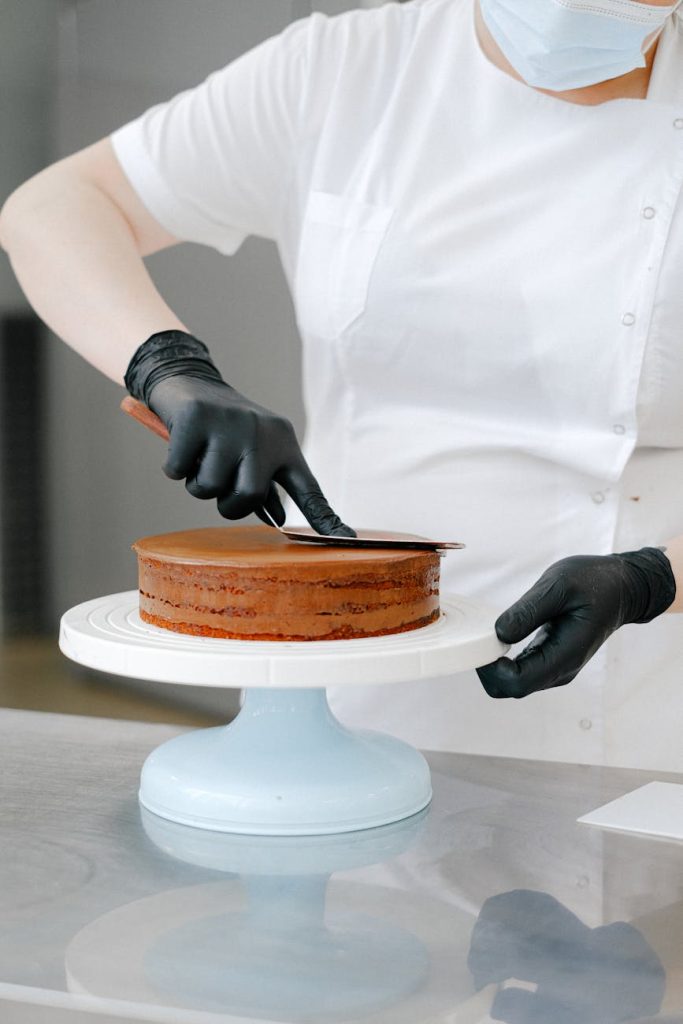 person baking a cake