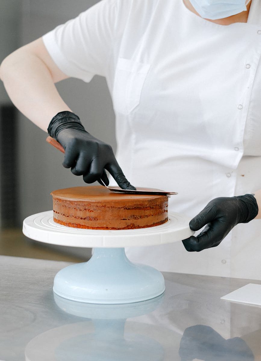 person baking a cake