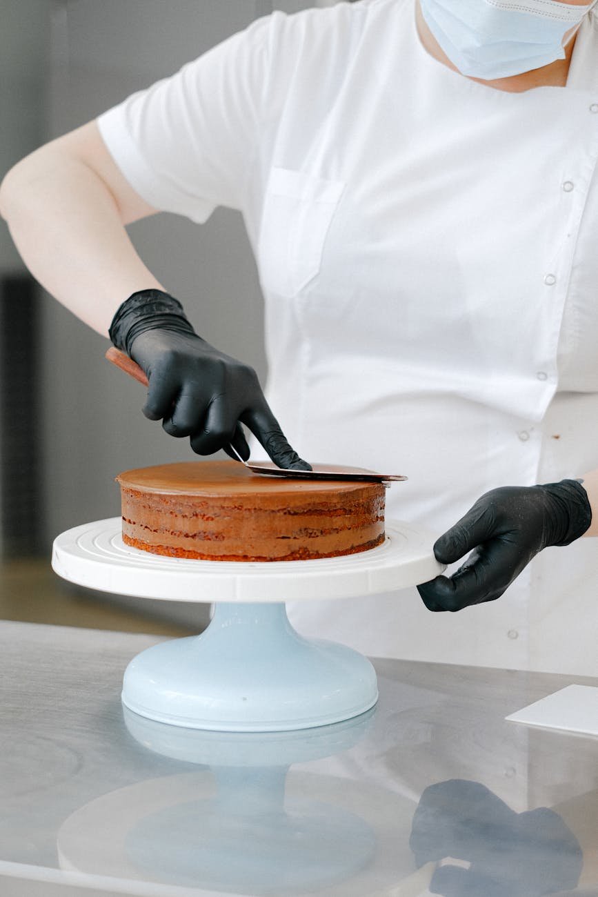 person baking a cake